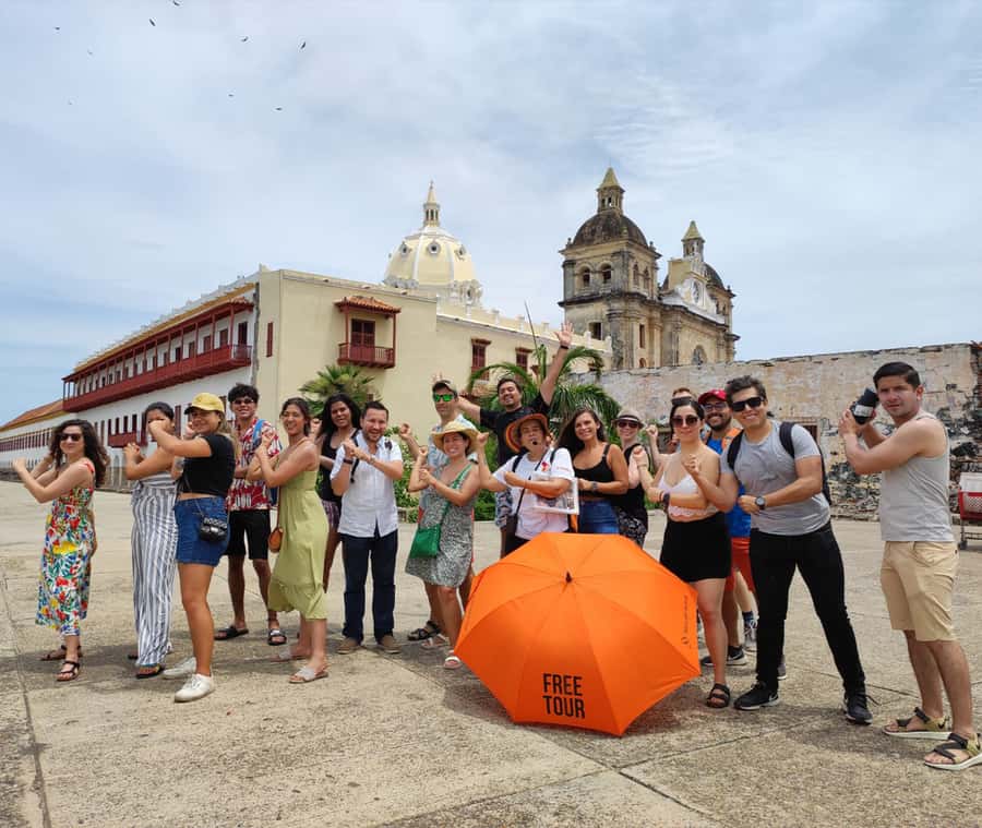 Cartagena: Historic Center and Getsemaní Shared Walking Tour - Getsemaní under umbrellas: street art, rhythm, and champeta energy