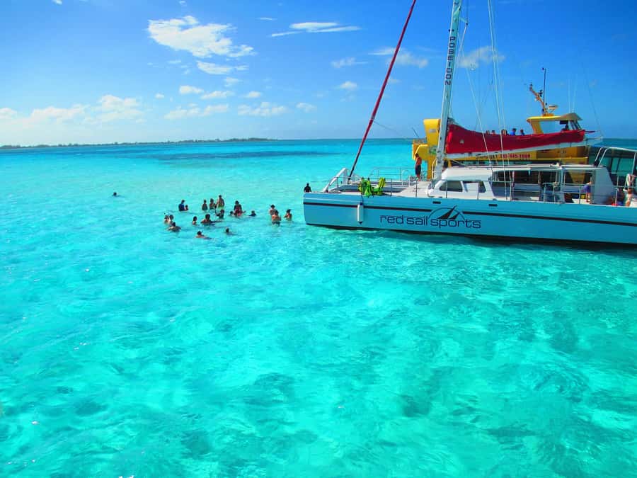 Cartagena: Party Boat to Cholon Beach with 2 Drinks & Lunch - Entering Cholón: Pool Access and Guided Beach Time