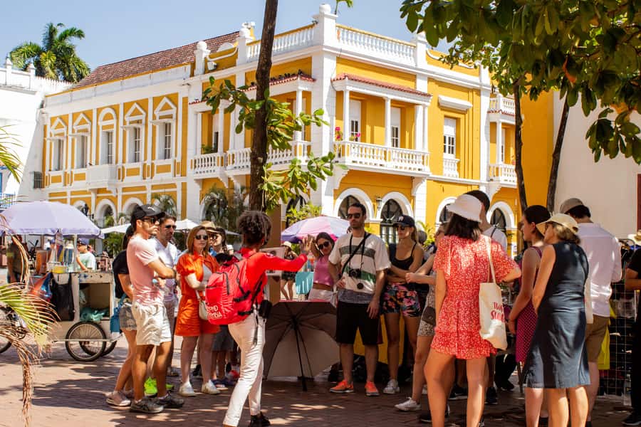 Shared Cartagena Old City Tour with Wireless Audio System - Plaza de los Coches and Plaza Bolívar: where power meets daily life